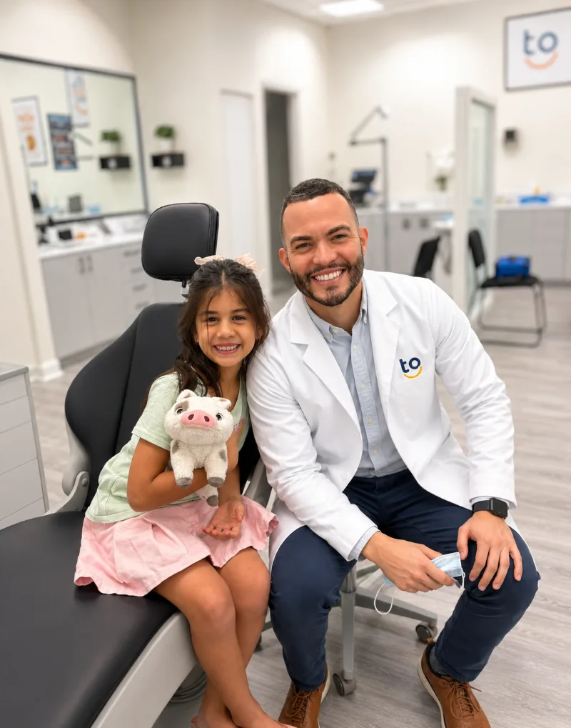 Dr. Rodney Torres with a smiling young patient in braces at Torres Orthodontics